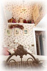 A cathedral ceiling soars above the angel bed in the Ballroom Suite at Dreams of Yesteryear Bed and Breakfast.