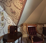 A private sitting area provides a relaxing space for reading the story of the bed and breakfast's history.