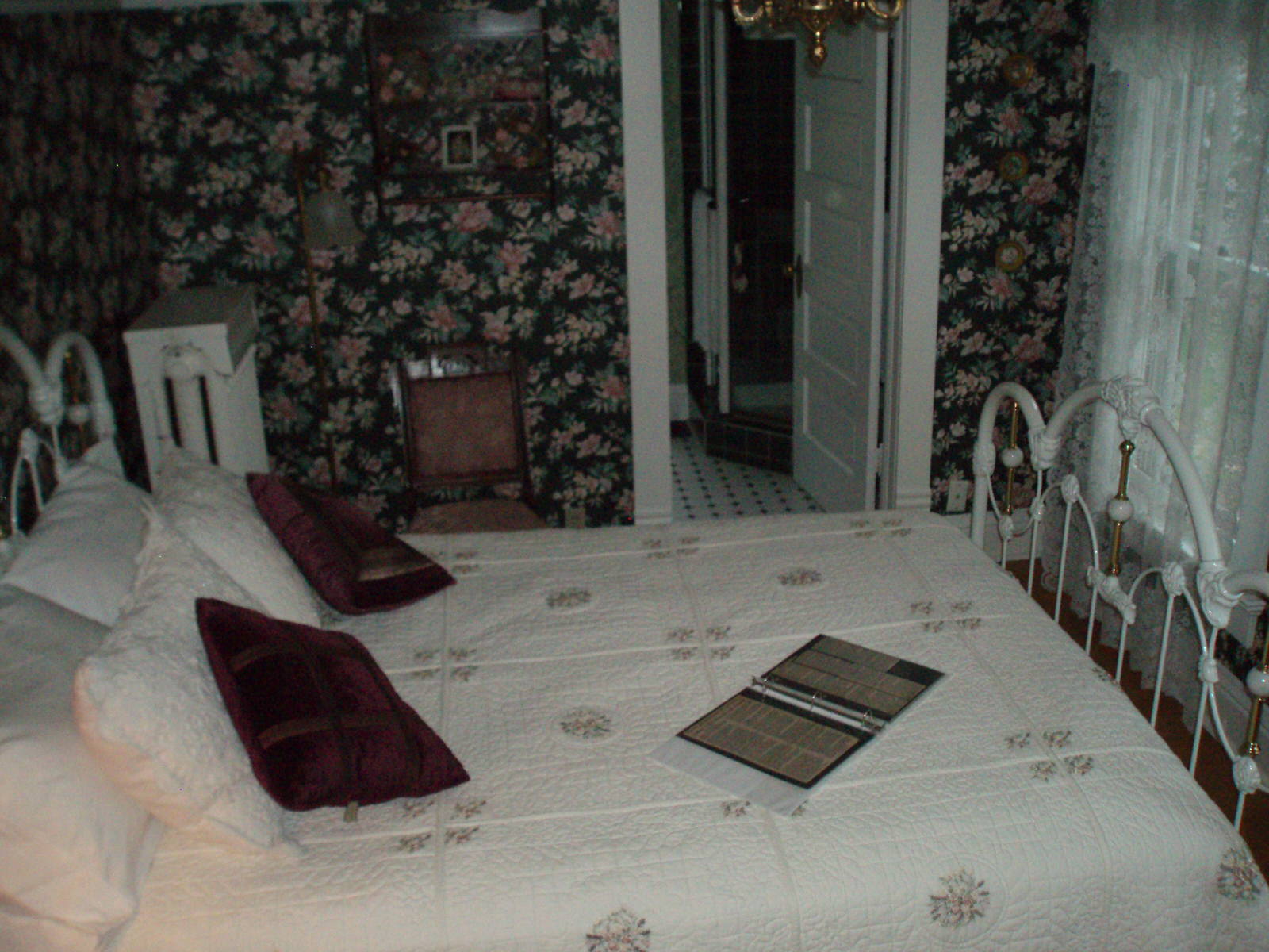 The gardenia wallpaper sets the mood for Victorian dreams in the Florence Myrna Room.