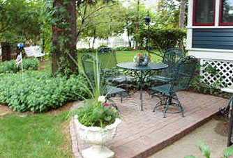 A patio provides a lovely place to rest and view the Victorian gardens.