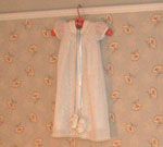 This baptismal gown is a piece of Maher family history, but fits in nicely with Gareld's Room light colored decor.