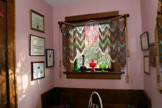 The foyer by the front door displays recognition for this historical home.