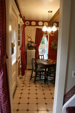 The entrance to the kitchen nook from the bottom of the maid's stairway.