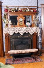 The fireplace once burned coal and now is used for cozy wood fires in the winter.