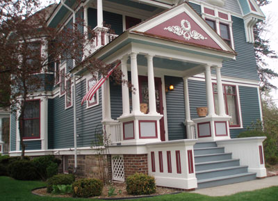 The front porch, restored based on photographs of the house after it was first built.