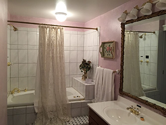 Relax in the luxurious whirlpool tub in the Ballroom Suite's private bath.
