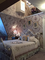 Enjoy heavenly dreams in the queen-sized angel bed.
