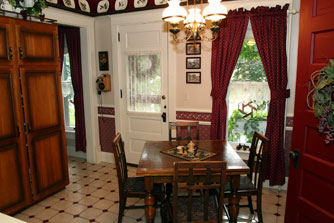 The kitchen nook with its antique pull-out table is a less formal dining option.