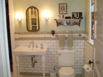 A large bathroom on the main floor is shared between Gareld's Room and the Maids Quarters.