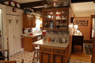 The wall between the kitchen and dining room that was moved to make more space for the ktichen from the former butler's pantry.
