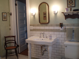 A large bathroom on the main floor is shared between the Maids Quarters and Gareld's Room.