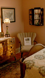 A wing-back chair tucked into the corner gives you a pleasant spot to read about the house's history.
