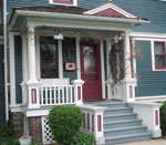 The porch on the west side of the house opens into the kitchen nook.