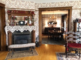 The fireplace once burned coal and now is used for cozy wood fires in the winter.
