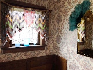 The foyer by the front door displays recognition for this historical home.
